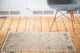 Vintage Turkish Oushak rug mat with soft beige, brown tones, and indistinct design abrashes.