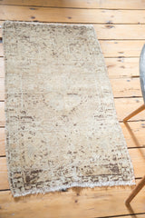 Muted cantaloupe and natural brown patterns with abrashes and fringe detail on this Oushak rug.