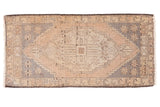 Distressed Oushak rug with peach field, slate blue geometric medallion, 1'9