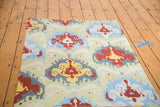 Hand woven Chainstitch rug: Ikat-inspired pattern in powder blue, cherry red, saffron yellow.