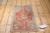 Vintage Oushak rug: pinwheel center medallion with tree motifs on a terra cotta field.