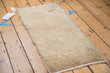 Underside of a vintage hand-knotted Turkish Oushak rug, showing natural fiber foundation.