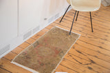 Vintage Turkish Oushak runner mat with subtle double medallion, blended warm tones.