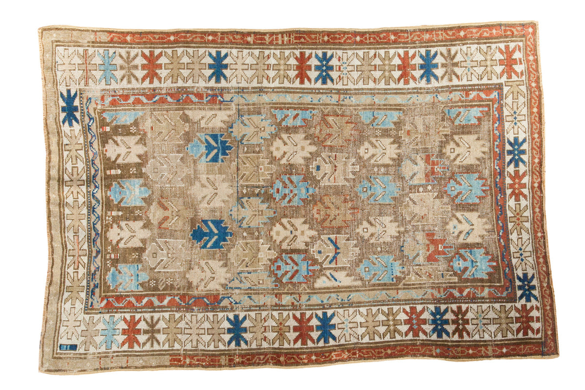 Antique Caucasian rug, geometric motifs in bark brown, madder red, and sky blue, 3'2" x 4'8".