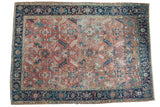 Blanched vintage Heriz carpet with expressive serrated leaves on a faded red field and navy border. 8'3