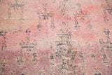 Plush overdyed wool pile of vintage Moroccan carpet, showing cranberry mauve and violet.