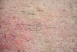 Plush wool pile detail of vintage Moroccan carpet showing overdyed cranberry mauve and violet tones.