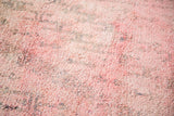 Plush, overdyed pile of vintage Moroccan carpet, showing cranberry mauve and violet tones.