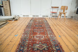 Distressed Persian Karaja runner with red and blue geometric medallions, 3' x 10'9