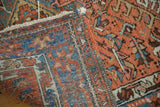 Distressed Karaja runner: worn red pile, geometric blue motifs, and hand-knotted foundation.