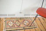 Vintage Oushak rug mat, geometric diamond medallion with faded terra cotta, tangerine, and ivory.