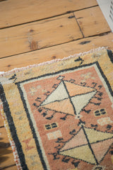 Hand-knotted vintage Oushak rug mat, faded terra cotta and ivory diamond pattern.
