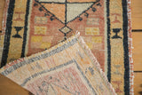 Hand knotted reverse weave and ivory fringe of a vintage Oushak rug.
