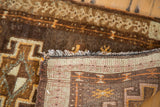 Detail of the vintage Oushak rug's intricate hand-knotted weave and secured edge.