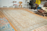 Allover distressed character of a vintage Mahal rug, showcasing geometric quatrefoil panels.