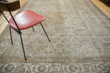 Distressed antique ivory and light brown Mahal rug with geometric field and border patterns.