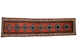 Faded brick red vintage Sarab rug runner with navy hexagonal medallions and reciprocating water motif.