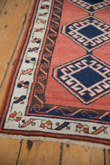 Fringe and geometric borders with cream motifs and charcoal reciprocating water design.