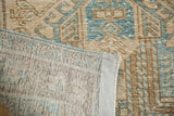 Hand-knotted foundation and distressed beige, blue geometric pile on vintage Heriz runner.