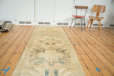 Long vintage Caucasian Oushak runner, rectilinear eagle medallions in lemony gold and faded teal.