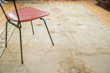 Vintage Oushak runner's soft wool pile with subtle abrashes and minimalist sand motifs.