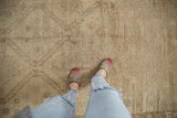 Distressed Oushak runner with subtle repeating panels, abrash, and visible pile texture.