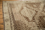Vintage Oushak rug runner corner, showing tone-on-tone brown serrated rectilinear pattern.