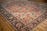 Unusual Herati border in navy, red, and ivory detail on a vintage Heriz rug.