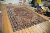 Vintage Heriz rug corner detailing unique serrated stepped spandrels and colorful borders.