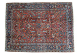 Vintage Heriz carpet with geometric field, central medallion, red, navy, and light blue, 7' x 9'6