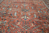 Geometric serrated leaf and floral cross section pattern on vintage Heriz rug.