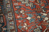 Vintage Heriz carpet, hand-knotted pile with burgundy, blue, and ivory geometric floral motifs.