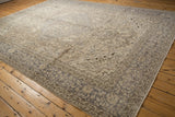 Faded ivory allover pattern and silver grey traditional border of distressed Oushak carpet.
