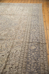 Distressed Turkish Oushak carpet's silver-grey border with faded ivory field patterns.