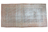 Distressed Oushak rug with allover paisley, faded cinnabar red and blanched teal tones.