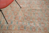 Distressed pile of Oushak carpet with faded terra cotta and blanched aqua boteh.
