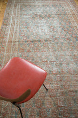 Distressed allover pattern of germinating flowers in cinnabar, terra cotta, and blanched teal.
