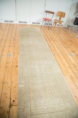 Long distressed Persian Malayer runner, subtle diamond floral design, sand and beige tones.