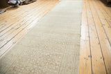 Light sand and beige distressed Malayer runner with intricate diamond floral motifs.