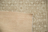 Distressed Malayer rug pile showing tone-on-tone diamond pattern and woven foundation.