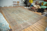 Distressed antique Sultanabad carpet, showing faded oblong medallion and allover herati field.