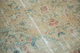 Luminous worn pile texture of an antique Sultanabad carpet, featuring muted floral herati pattern.