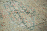 Distressed antique Sultanabad rug, low pile revealing faded Herati in soft green, terra cotta.