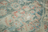 Distressed antique Sultanabad rug pile, featuring soft mallard green and terra cotta tones.