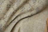 Distressed ivory beige Oushak carpet pile with subtle charcoal floral vinery.