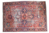 Distressed Ahar Heriz carpet: cherry red field, ivory medallion, and navy borders, 8'2