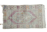 Distressed Oushak rug with faded violet hexagonal medallion and mint green field. 2'9