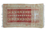 Distressed Oushak runner, faded cherry red and sand field with diamond and floral columns.
