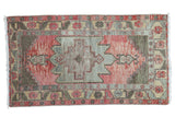 Distressed hand-knotted Turkish Oushak rug with faded cranberry field, geometric medallion, 3' x 5'4