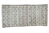 Hand-knotted distressed Oushak runner, washed neutral tones, faded blush and gold floral motifs.